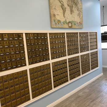 Rows of secure private mailboxes inside Instant Passport Photo